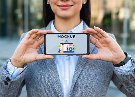 Free Businesswoman Outdoors Holding Phone Mockup Psd