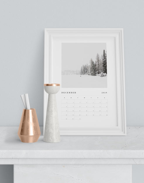 Free Calendar In Painting Frame On Table Psd