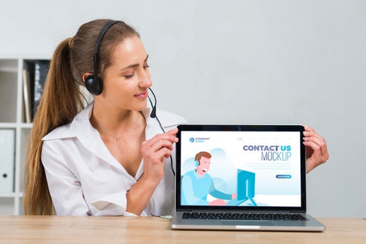 Free Call Center Operator Looking At A Mock-Up Laptop Psd