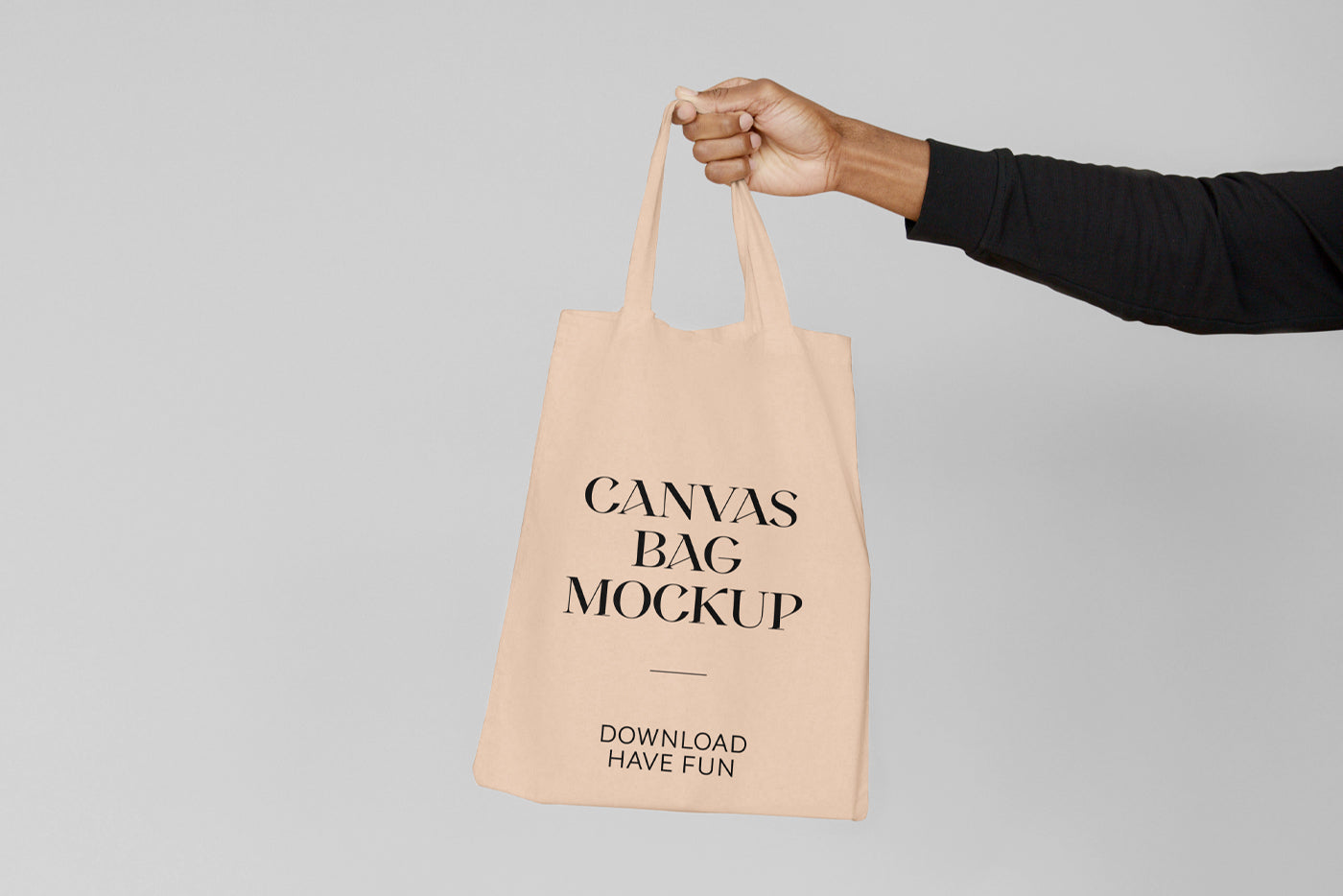 Free Canvas Bag With Hand Mockup
