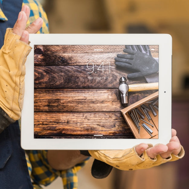 Free Carpenter Holding Tablet Mockup Psd