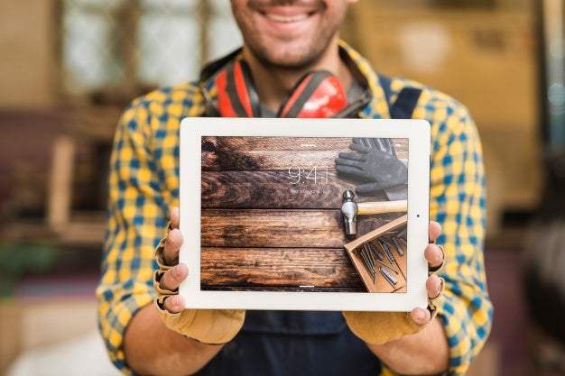 Free Carpenter Holding Tablet Mockup Psd