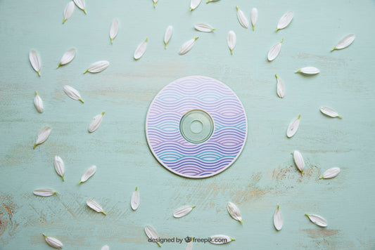 Free Cd Mockup With White Petals Psd