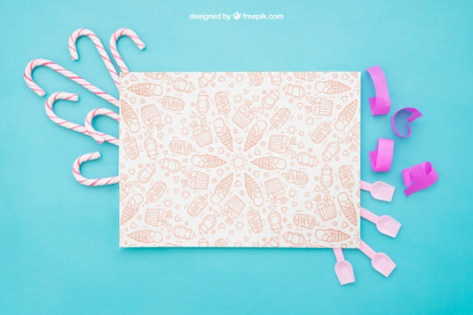Free Celebration Composition With Paper And Candy Canes Psd