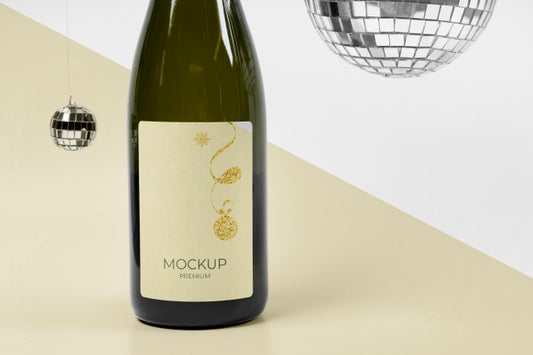 Free Champagne Bottle Mock-Up And Silver Disco Balls Psd