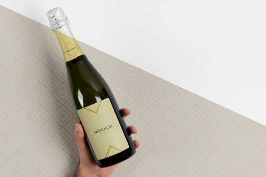 Free Champagne Bottle Mock-Up Held In Hand Psd