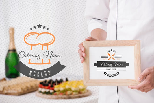 Free Champagne Next To Frame With Catering Name Placeholder Psd