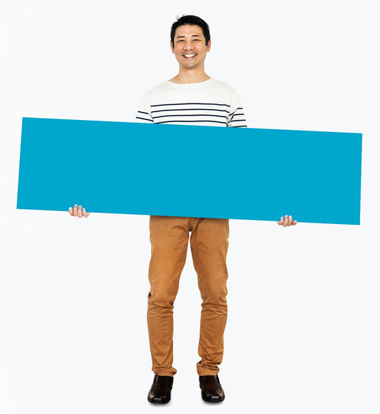 Free Cheerful Man Holding A Blank Blue Banner