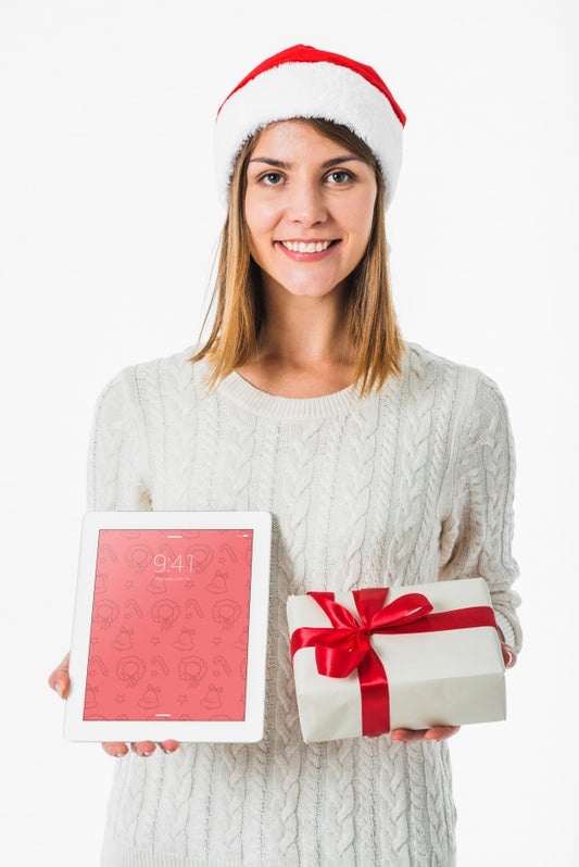 Free Christmas Concept With Woman Holding Tablet Mockup Psd
