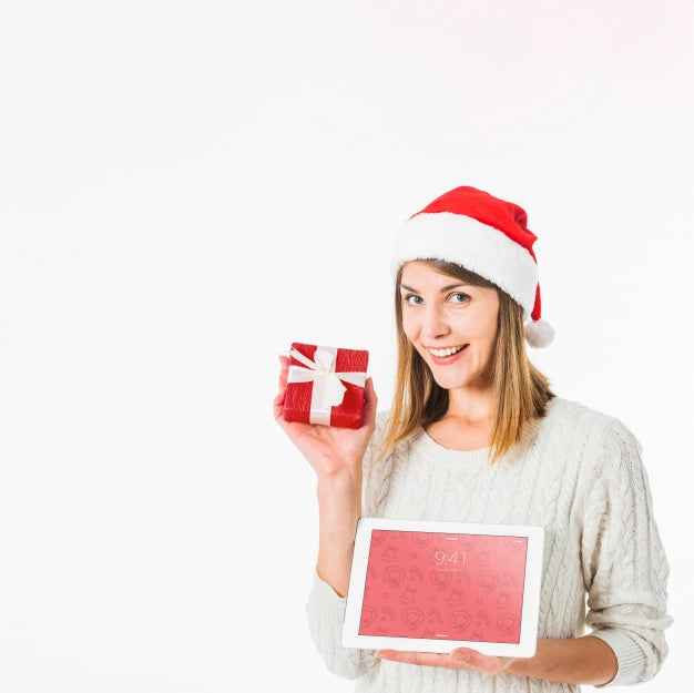 Free Christmas Concept With Woman Holding Tablet Mockup Psd