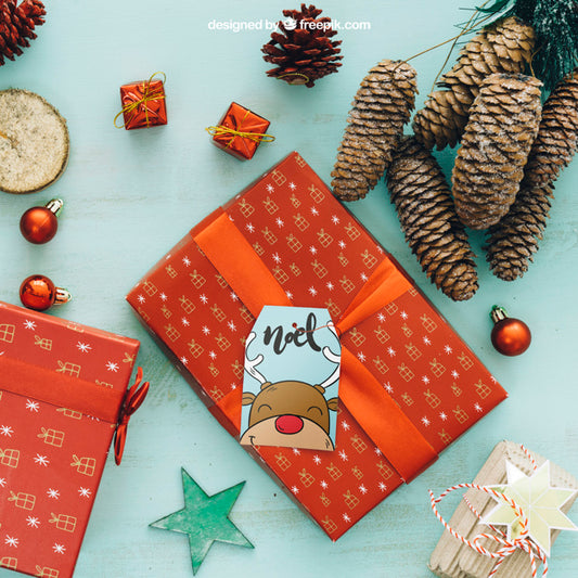 Free Christmas Mockup With Gift Box And Pine Cones Psd