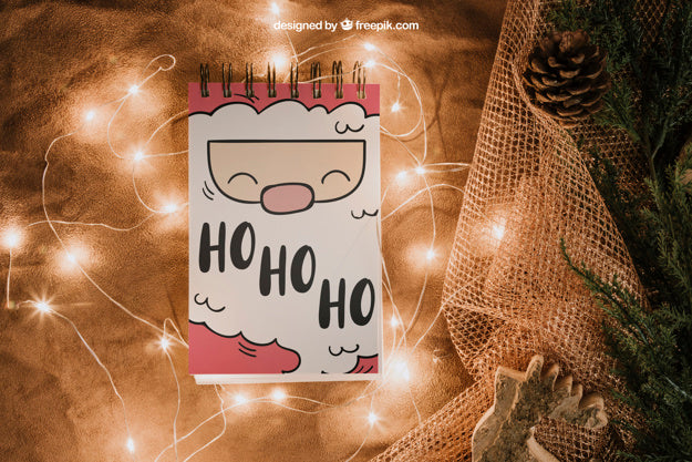 Free Christmas Mockup With Notepad And Lights Psd