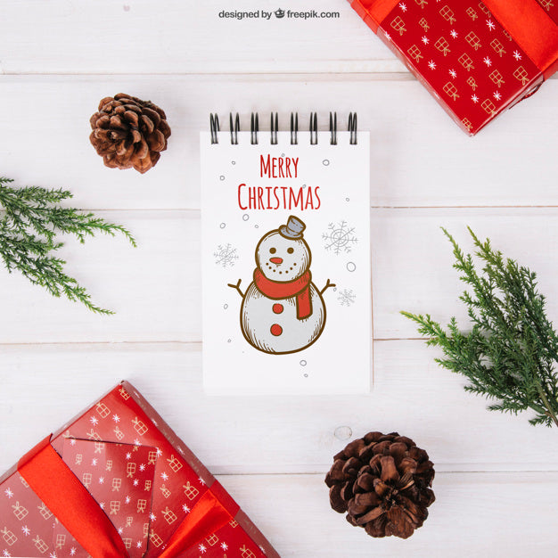 Free Christmas Mockup With Notepad Between Presents Psd