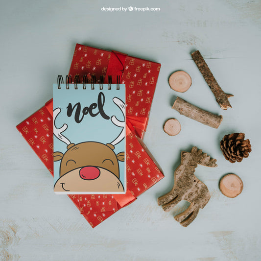 Free Christmas Mockup With Notepad On Presents Psd