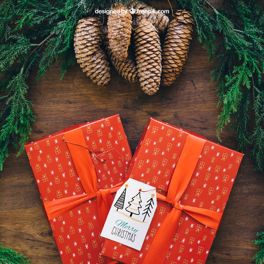 Free Christmas Mockup With Present And Pine Cones Psd
