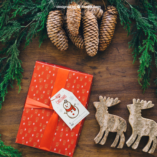 Free Christmas Mockup With Present And Reindeers Psd