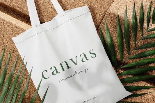 Free Clean Minimal Bag Canvas Mockup On Plate With Leaves Background. Psd File. Psd