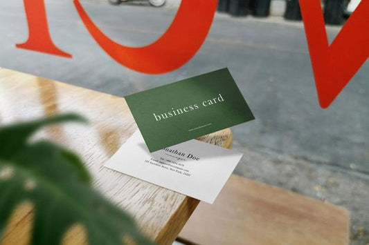 Free Clean Minimal Business Card Mockup Floating On Top Wood In Cafe And Leaves Background. Psd File. Psd