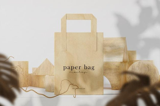 Free Clean Minimal Paper Bag Mockup On Front Wooden Block And Leaves Background. Psd File. Psd