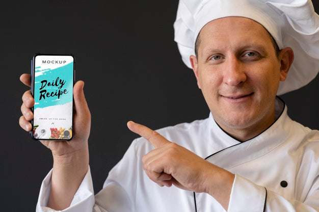 Free Close-Up Chef Holding Smartphone Psd