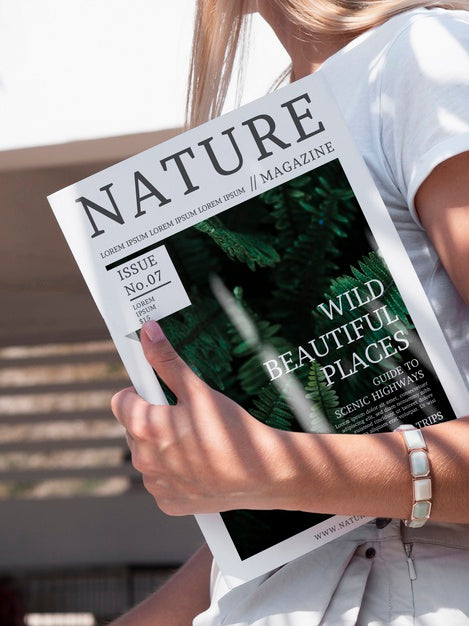 Free Close-Up Hand Holding A Nature Magazine Mock Up Psd