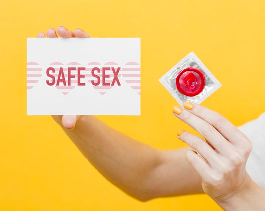 Free Close-Up Hand Holding Red Condom Psd
