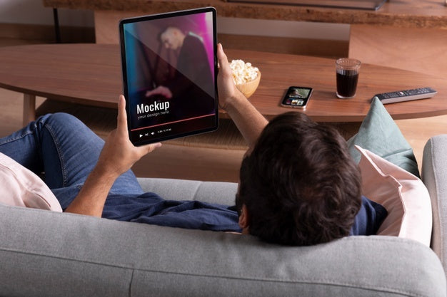 Free Close Up Man Watching Movie On Tablet Psd