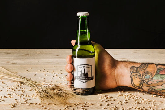 Free Close-Up Person Holding A Beer Bottle Psd