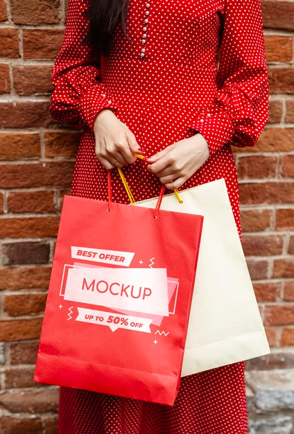 Free Close-Up Woman Holding Shopping Bags Outdoors Psd