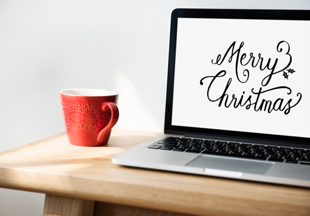 Free Closeup Of Computer Laptop With Merry Christmas Words Psd