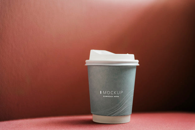 Free Coffee Cup Mockup In A Red Backdrop Psd