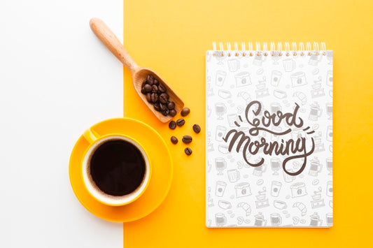 Free Coffee Cup Next To A Notebook Mock-Up Psd