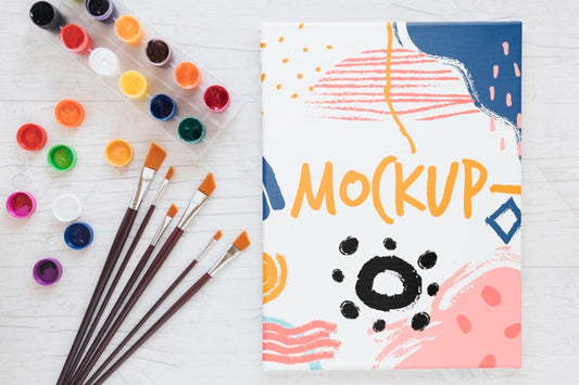Free Coloured Canvas With Paint And Brushes Mock-Up Psd