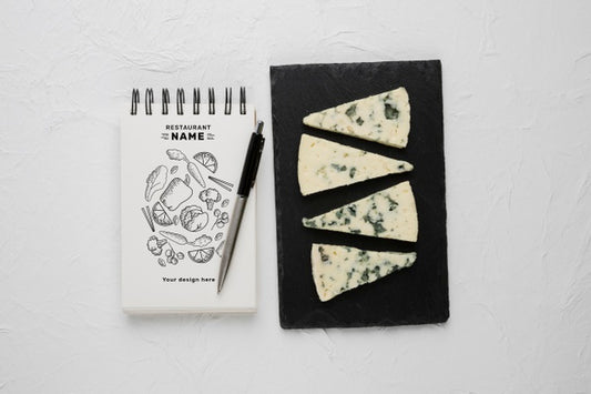 Free Composition Of Delicious Cheese With Notepad Mock-Up Psd