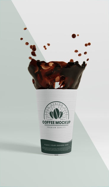 Free Composition Of Paper Coffee Cup With Coffee Splash Psd