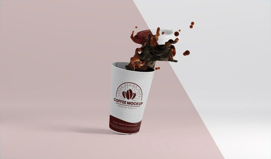 Free Composition Of Paper Coffee Cup With Coffee Splash Psd