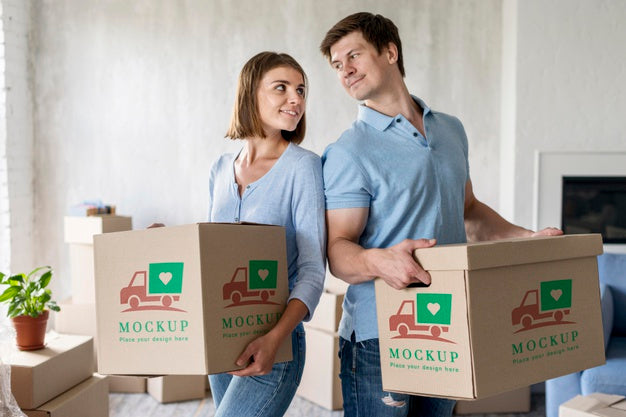 Free Couple Holding Boxes For Their New Home And Looking At Each Other Psd