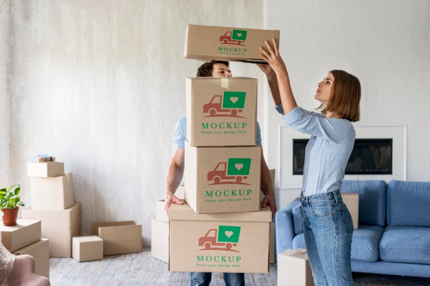 Free Couple Holding Boxes For Their New Home Psd
