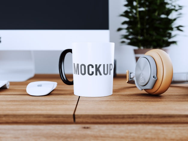 Free Cup On Wooden Desk Mock Up Psd