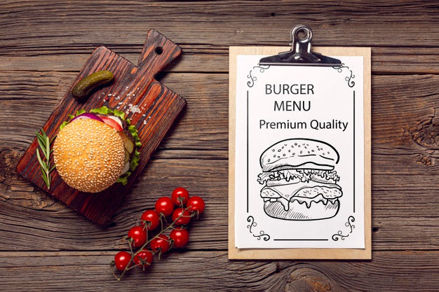Free Delicious Tomatoes And Burger On Wooden Background Psd