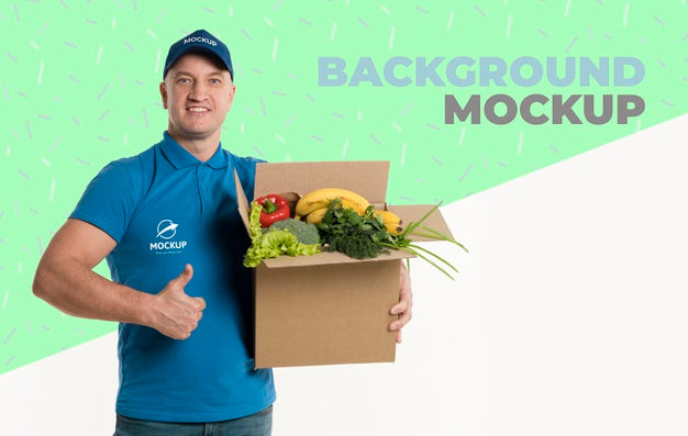 Free Delivery Man Holding A Box Full Of Vegetables With Background Mock-Up Psd