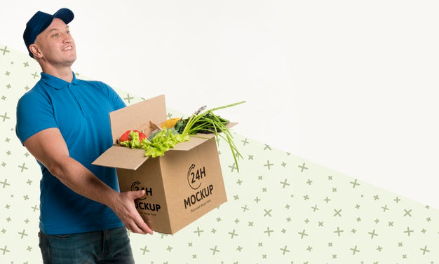Free Delivery Man Holding A Box With Different Vegetables With Copy Space Psd
