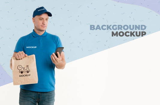 Free Delivery Man Holding A Shopping Bag While Looking At His Phone Psd