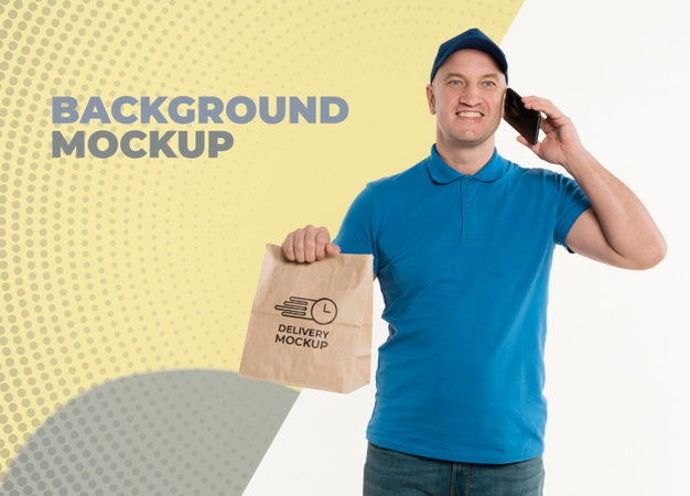 Free Delivery Man Holding A Shopping Bag While Talking On The Phone Psd
