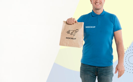 Free Delivery Man Holding A Shopping Bag With Copy Space Psd