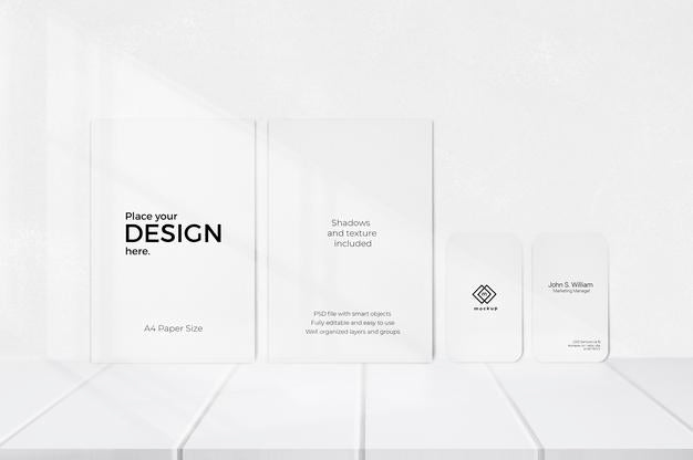 Free Editable Template Of Sheets And Visiting Cards In Front Of White Wall Psd