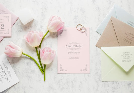 Free Fat Lay Of Wedding Card With Wedding Rings And Tulips Psd
