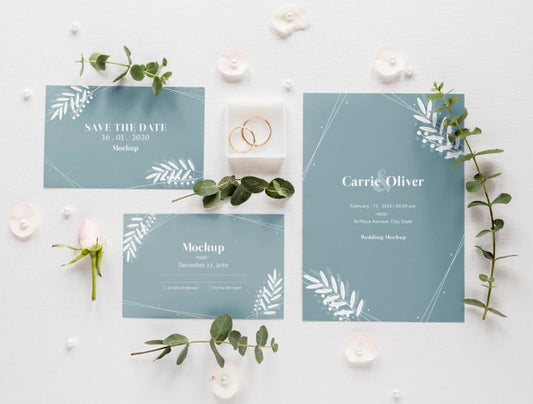 Free Fat Lay Of Wedding Cards With Plants And Rings Psd