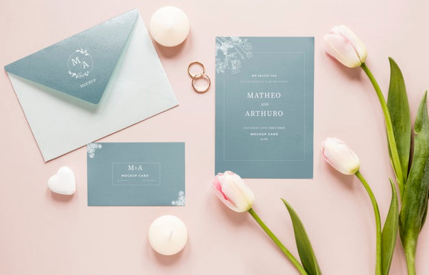 Free Fat Lay Of Wedding Cards With Tulips And Rings Psd