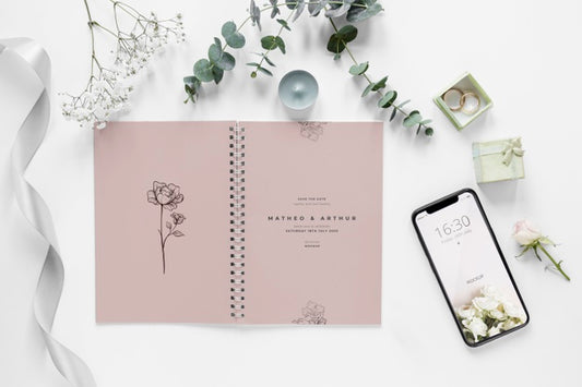 Free Fat Lay Of Wedding Notebook With Smartphone And Plants Psd